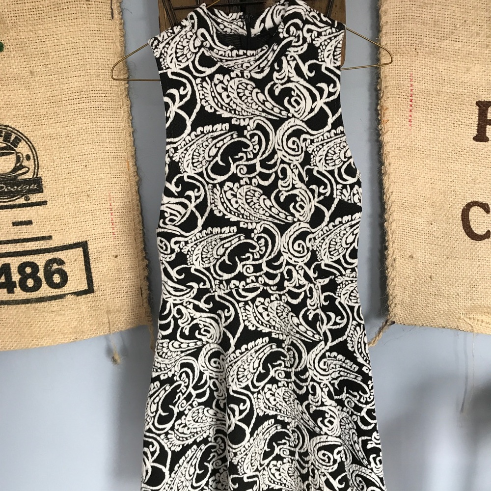Patterned black and white dress with high neck
